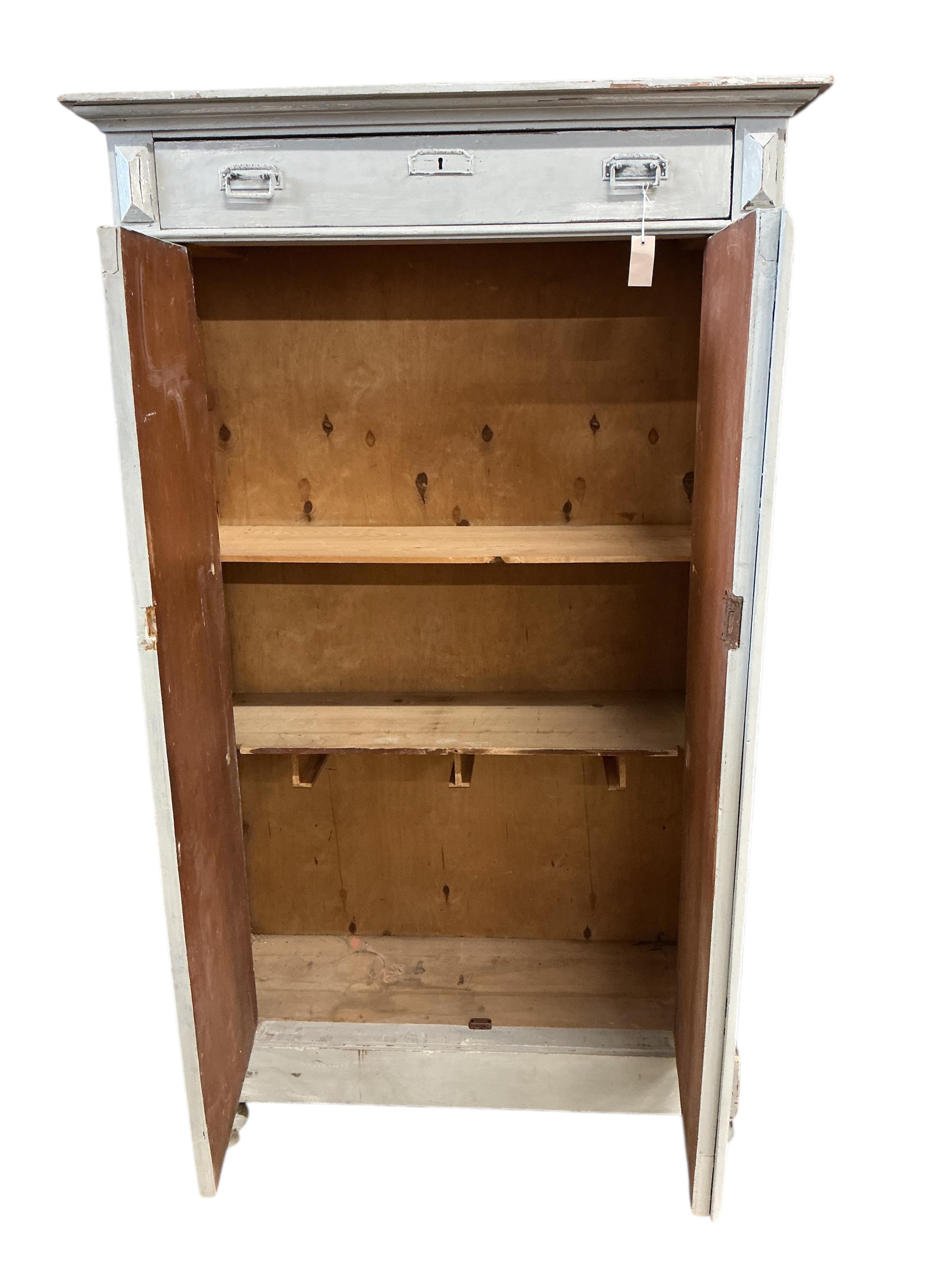 A 19th century Continental painted pine press cupboard, width 110cm, depth 40cm, height 186cm